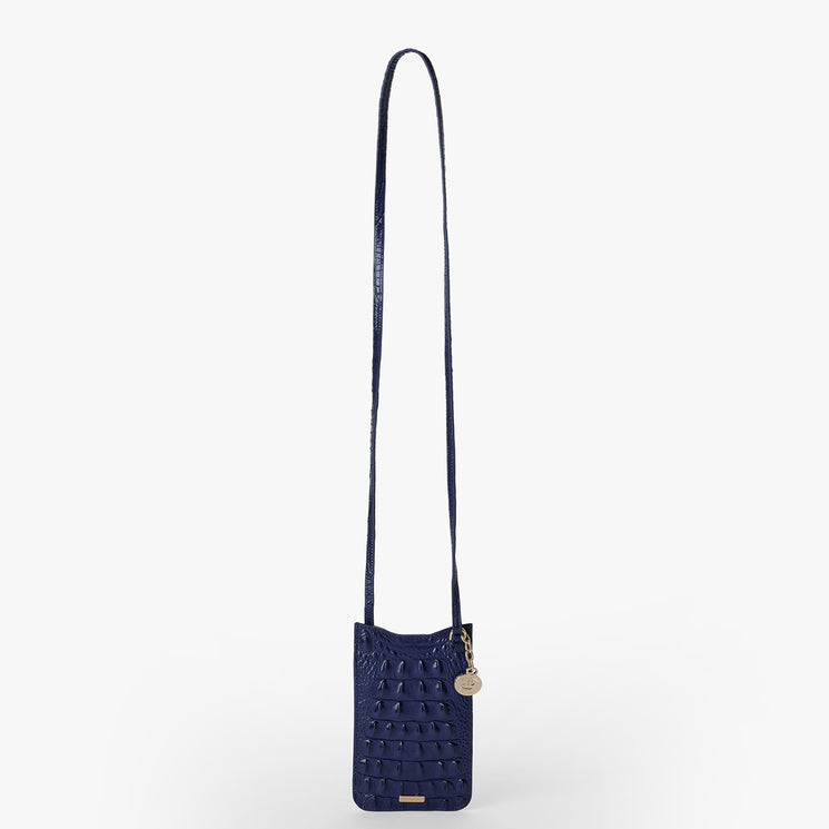 Brahmin Eris crossbody bag in Midnight Blue Melbourne textured leather with a structured silhouette, gold-tone logo tag, round charm, long adjustable strap; displayed on a plain white background.
