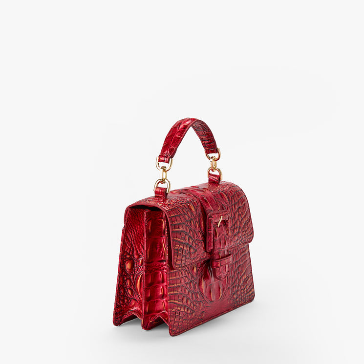 BRAHMIN Small Hallie red satchel featuring embossed texture, gold hardware, structured silhouette, top handle, flap with turn lock closure; displayed on a plain white background.