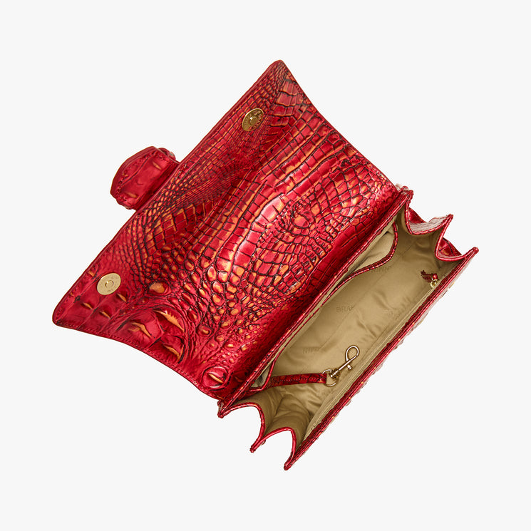 BRAHMIN Small Hallie satchel in red with embossed textured finish, compact shape, gold turn-lock closure. Bag open to show beige interior, zip pocket, key leash. Displayed against a white background.