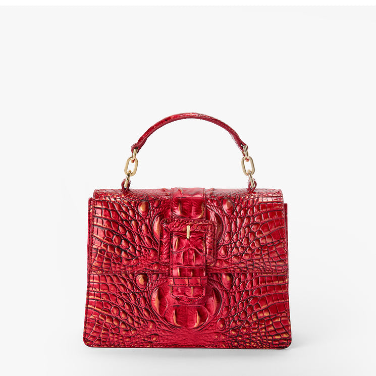 BRAHMIN Small Hallie satchel in embossed red leather with top handle, gold hardware, flap turn lock closure, structured silhouette, and textured pattern. Shown on a plain white background.